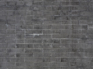 A gray brick wall with mud stains and dark smudges. Not seamless texture. Full screen photo