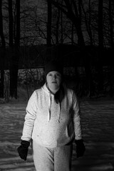 Lady outdoors portrait with one side light in a cold winter evening
