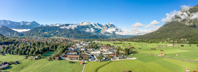 Aerial panorama view of Garmisch Partenkirchen Village with view of Zugspitze in fog