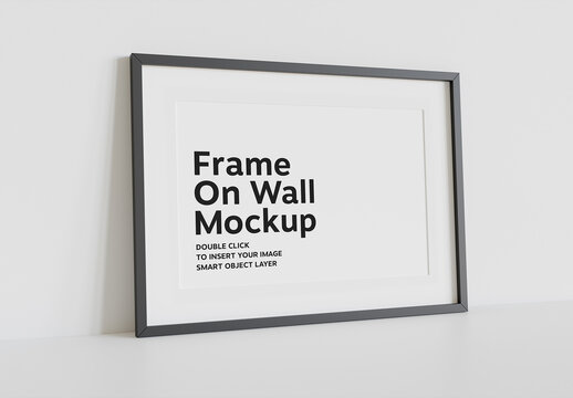 Black Frame Leaning on Wall Mockup