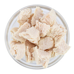 Pieces of boiled chicken breast in bowl isolated on white background. Top view