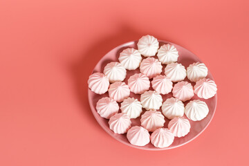Sugar protein dessert in pastel colors in a pink plate on pink background. The view from the top. Copy Space