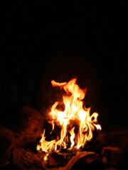 Blurred natural flame, the texture of the campfire at night, strong flames, flame background