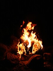 Blurred natural flame, the texture of the campfire at night, strong flames, flame background