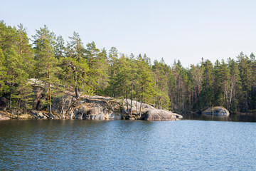 View of Lake Meiko area in spring, rocks, pine trees and lake, Kirkkonummi, Finland