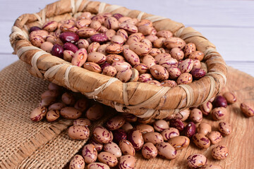 Natural bean grains, Phaseolus vulgaris on wooden background with light veins