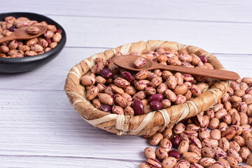 Natural bean grains, Phaseolus vulgaris on wooden background with light veins