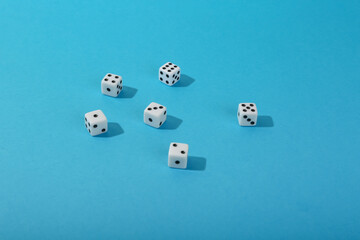 dice on blue background top view with copy space. 