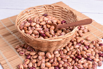 Natural bean grains, Phaseolus vulgaris on wooden background with light veins
