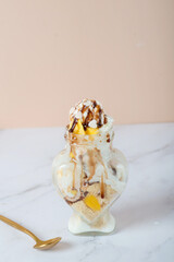 Dessert of mango, pears and ice cream. Shallow dof.