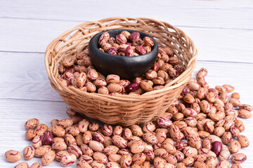 Natural bean grains, Phaseolus vulgaris on wooden background with light veins