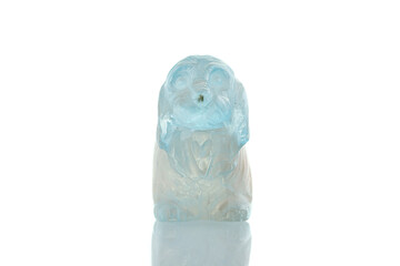 beautiful statuette of a dog from the mineral topaz on a white background