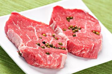 Fresh fillet of beef with green pepper. 