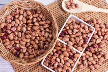 Natural bean grains, Phaseolus vulgaris on wooden background with light veins