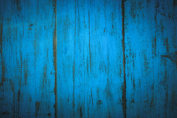 Fototapeta na wymiar Wooden background with a blue colored paint in the style of shabby