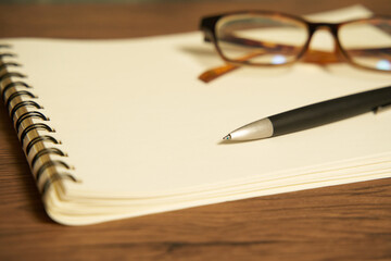 Fototapeta premium Glasses and notebook