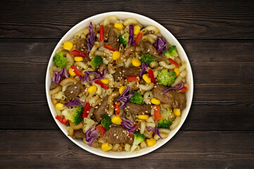 Asian food, meat with vegetables and sesame