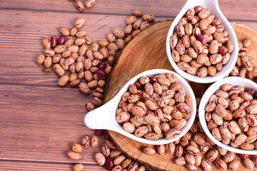 Natural bean grains
Phaseolus vulgaris on dark grain wood background