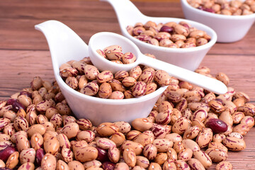 Natural bean grains
Phaseolus vulgaris on dark grain wood background