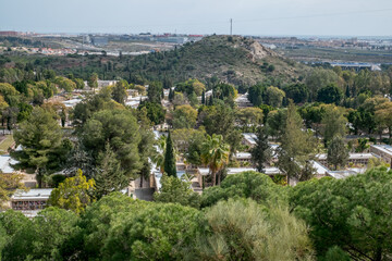 View of the famous Malaga Park Cemetery with graves and crypts, decorated with bouquets of flowers
