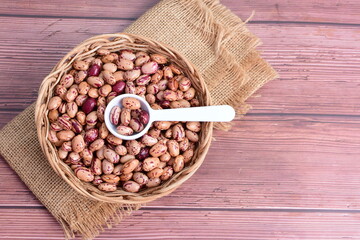 Natural bean grains
Phaseolus vulgaris on dark grain wood background