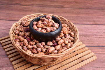 Natural bean grains
Phaseolus vulgaris on dark grain wood background