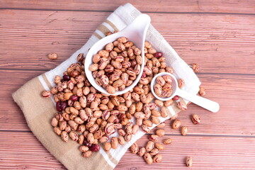 Natural bean grains
Phaseolus vulgaris on dark grain wood background