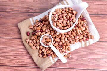 Natural bean grains
Phaseolus vulgaris on dark grain wood background