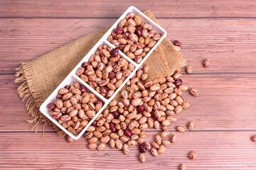 Natural bean grains
Phaseolus vulgaris on dark grain wood background