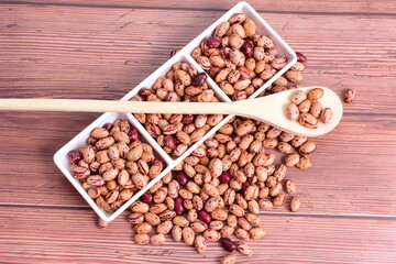 Natural bean grains
Phaseolus vulgaris on dark grain wood background
