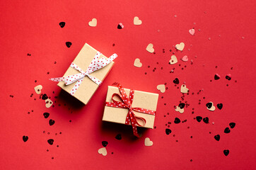 Valentines day gift boxes on red paper background