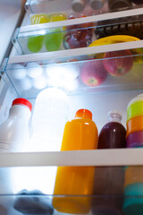 Fridge door full of healthy food and drinks