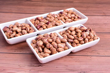 Natural bean grains
Phaseolus vulgaris on dark grain wood background