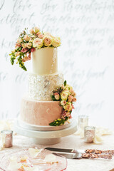 Beautiful wedding cake with floral arrangement