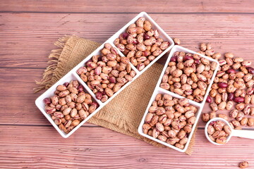 Natural bean grains
Phaseolus vulgaris on dark grain wood background