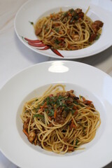plates with spaghetti, chicken and vegetables in soy sauce, pasta on a plate, carbohydrates for lunch