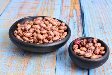 
Natural bean grains
Phaseolus vulgaris on blue grain wood background