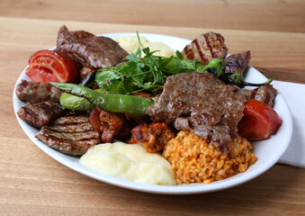 Mixed kebab with bulgur pilaf and mashed potato
