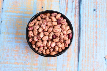 
Natural bean grains
Phaseolus vulgaris on blue grain wood background