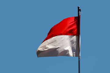 Indonesia flag with flat sky background. independence day concept.
