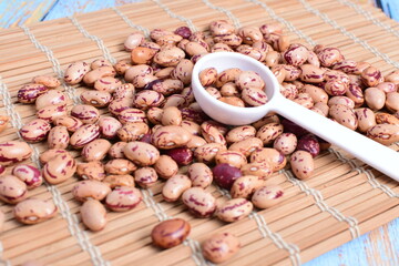 
Natural bean grains
Phaseolus vulgaris on blue grain wood background