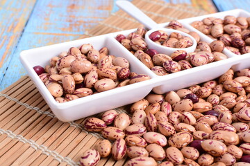 
Natural bean grains
Phaseolus vulgaris on blue grain wood background