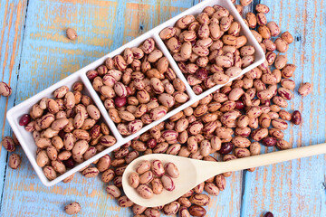 
Natural bean grains
Phaseolus vulgaris on blue grain wood background