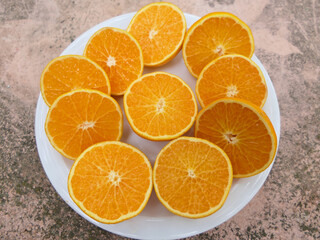 Clementines Cut In Half On A Plate