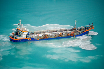 Suction Dredger Emptying Sluices, Spoiling Water of Gulf with mud Spot, Pollution, brown Muddy...