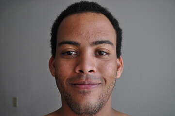 Obraz premium Mixed Race man stubbled face expression content