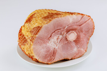 Spiral sliced whole ham isolated on white background.