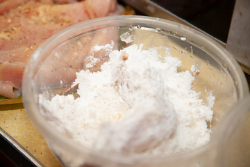 Raw, Lightly Breaded Chicken Tender