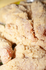 Breaded and Seasoned Raw Chicken Breasts