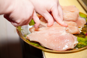 Woman Cutting Chicken